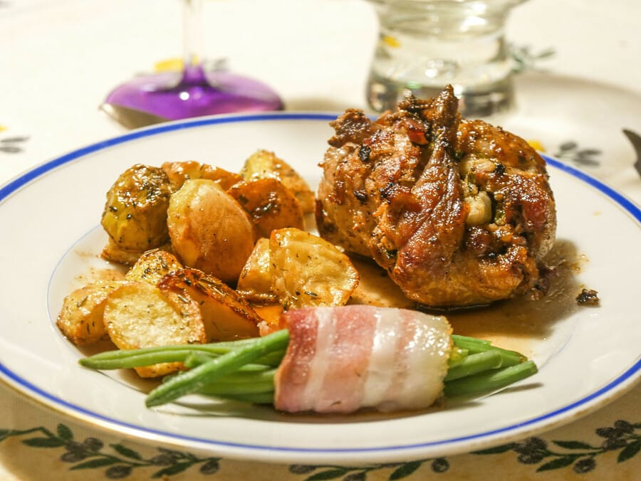 Quail stuffed with napa cabbage, served with a port sauce and garlic and rosemary baby potatoes