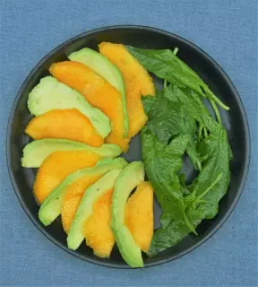 Mango and avocado carpaccio with baby spinach