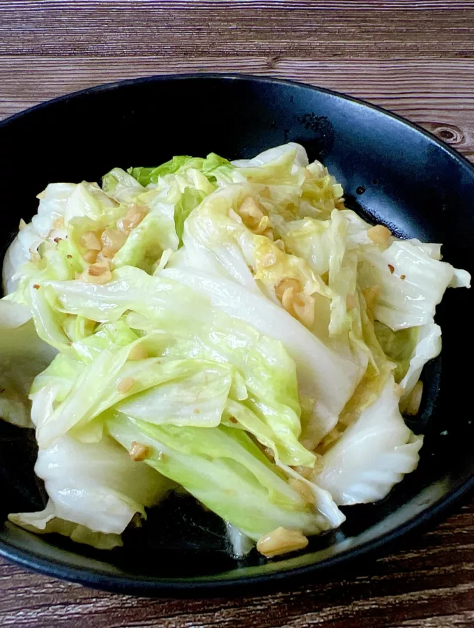 Top view table stir fried cabbage with fish sauce (Asian food style) Chou vert sauté sauce soja