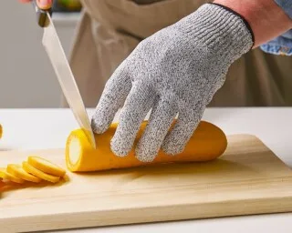 What is the purpose of a cut-resistant glove in the kitchen?