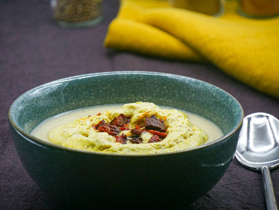 Cream of parsnip soup with curry mousse and chorizo