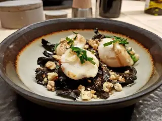 Seared scallops on a bed of mushrooms