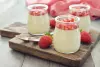 Verrine of panna cotta with pan-seared strawberries and homemade cookie Verrine of panna cotta with pan-seared strawberries and homemade cookie